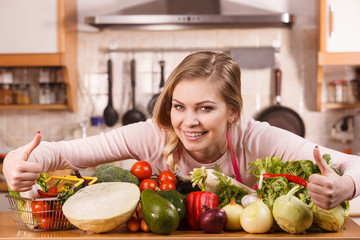 Woman having vegetables on table