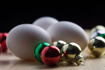 Eggs with colored christmas decorative balls