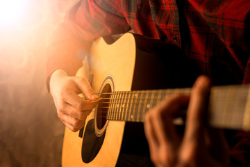Man playing the guitar, close-up
