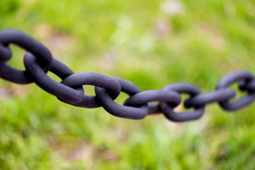 Abstract selective-focus shot of a chain with a very thin layer of sharpness. Macro shot.