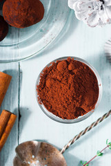 Christmas dessert chocolate truffles and spices on white wood