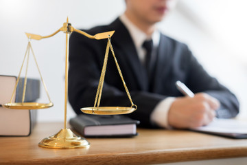 tribunal Attorney lawyer working with documents and wooden gavel on tabel in courtroom. justice advice and law judge legislation concept.