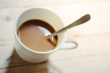 Close up coffee cup on the table.