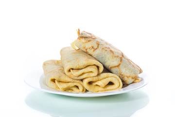 fried thin pancakes stuffed on a plate