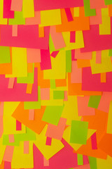 Bright multi-colored stickers on the office white board.