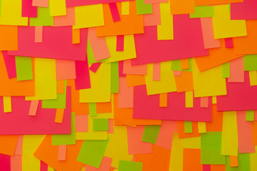 Bright multi-colored stickers on the office white board.