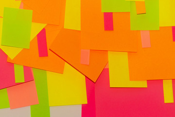 Bright multi-colored stickers on the office white board.