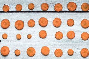 orange slices of carrot on a white background