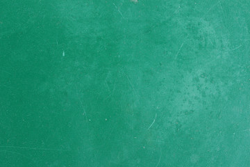 Fototapeta na wymiar Green painted aged metal table top surface detail