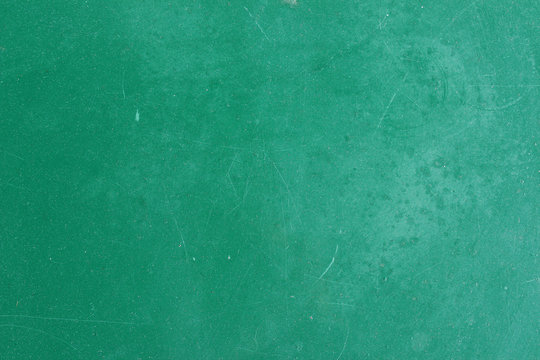 Green painted aged metal table top surface detail