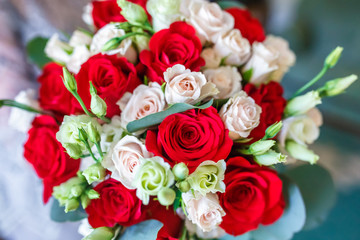 bridal bouquet of white and red roses