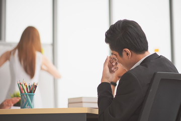 Successful business young woman presenting to employees which headache, business coach giving presentation to clients in meeting room, team leader reporting about work explaining result on whiteboard,