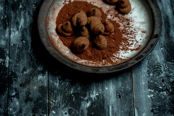 sweet, chocolate truffles and bitter cocoa on a romantic, dark background