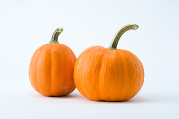 two pumpkins isolated on white background
