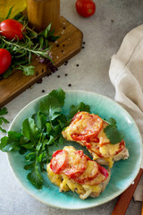 Meat chops with tomato on stone table. Festive dinner or lunch.