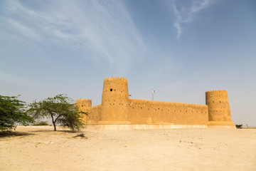 Al Zubara Fort (Az Zubarah Fort), historic Qatari military fortr built from coral rock and limestone and cemented with a mud mortar, old cannon nearby