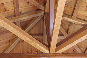 Fototapeta na wymiar Wooden beams house interior roof detail abstract