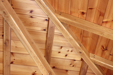 Fototapeta na wymiar Wooden beams house interior roof detail abstract