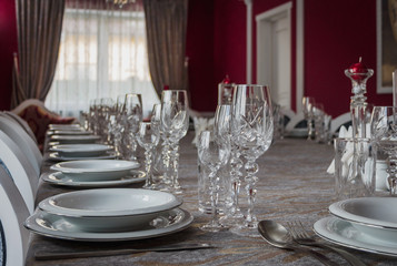 Serving the banquet table. Crystal glasses