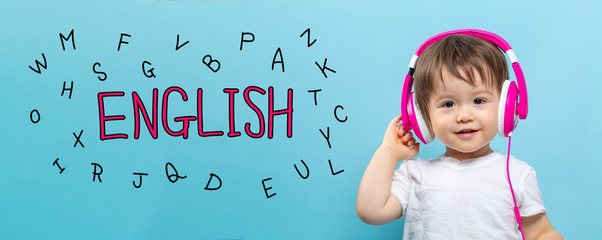 English with alphabets with toddler boy with headphones on a blue background