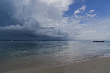 A seascape. Before the rain. Dramatic sky in front of a tropical downpour.