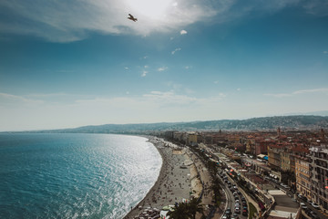 Panoramic view of Nice coastline and beach with blue sky, France.