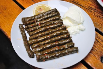 Turkish style pencil-thin stuffed vine leaves, served with lemon and yogurt in Trabzon, Turkey