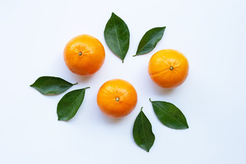 Fresh orange citrus fruit with leaves isolated on white background.  Top view
