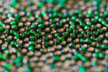 Green glass beads macro.