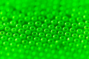 Green glass beads macro.