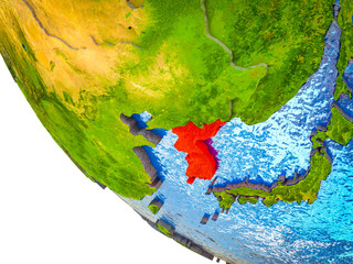 Korea on model of Earth with country borders and blue oceans with waves.