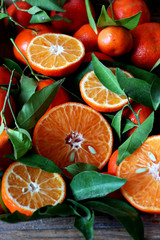 Fresh oranges and tangerines with leaves