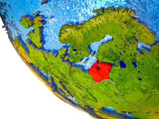 Baltic States on model of Earth with country borders and blue oceans with waves.