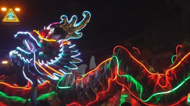 Chinese dragon performing at night.