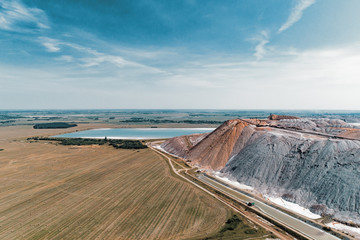 A large pile of unused rock, industrial storage of loose materials. Aerial view