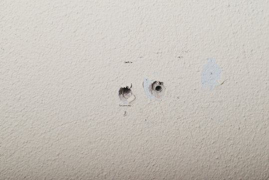 Two holes in the wall foam or aerated concrete for the installation of dowels for bolts