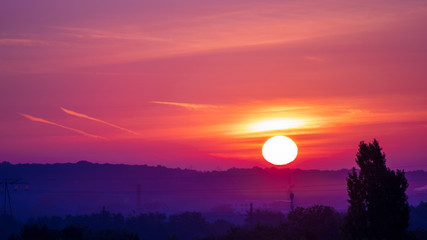 Obraz premium The whole sun put down on the skyline in orange sky