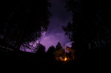 Tourist camp at night. Campfire.