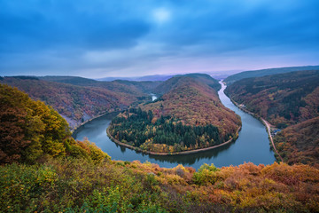 Fototapeta na wymiar Saarschleife, Germany - famous autumn landscape with river bend in Saarland