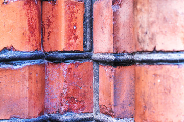 Element masonry red brick with concrete joints on the facade of an old house in Stockholm