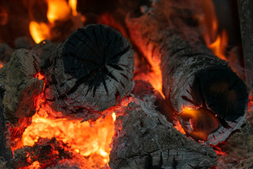 burning logs and charcoal in the furnace, closeup