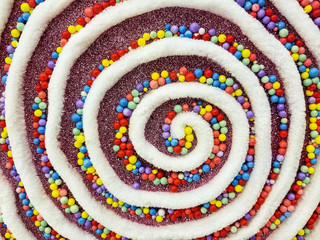 close up of white chenille fabric with colorful beads for holiday ornament