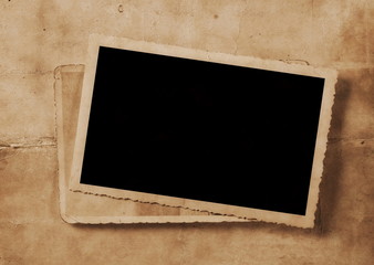 Vintage background with old blank photo frame texture