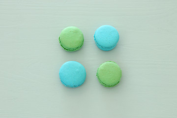 Top view of colorful macaron or macaroon over pastel background. Flat lay.