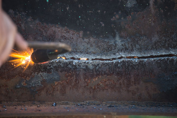 Worker cuts and brews black metal close-up shot