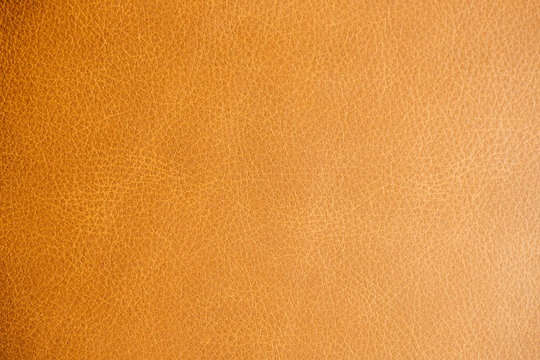 Orange luxury leather texture abstract background.