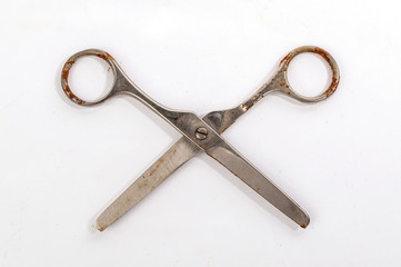 Open rusty steel scissors top view