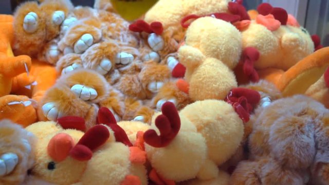 Classic children's arcade game, claw grabs stuffed dolls prize
