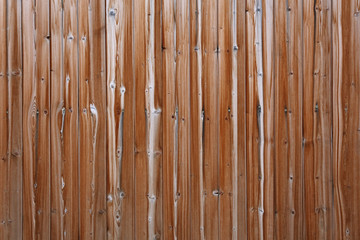 Old vintage brown weathered wooden planks fence