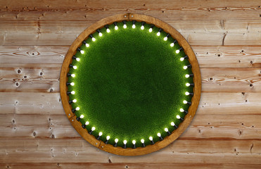 Wooden ring light frame with green grass backdrop